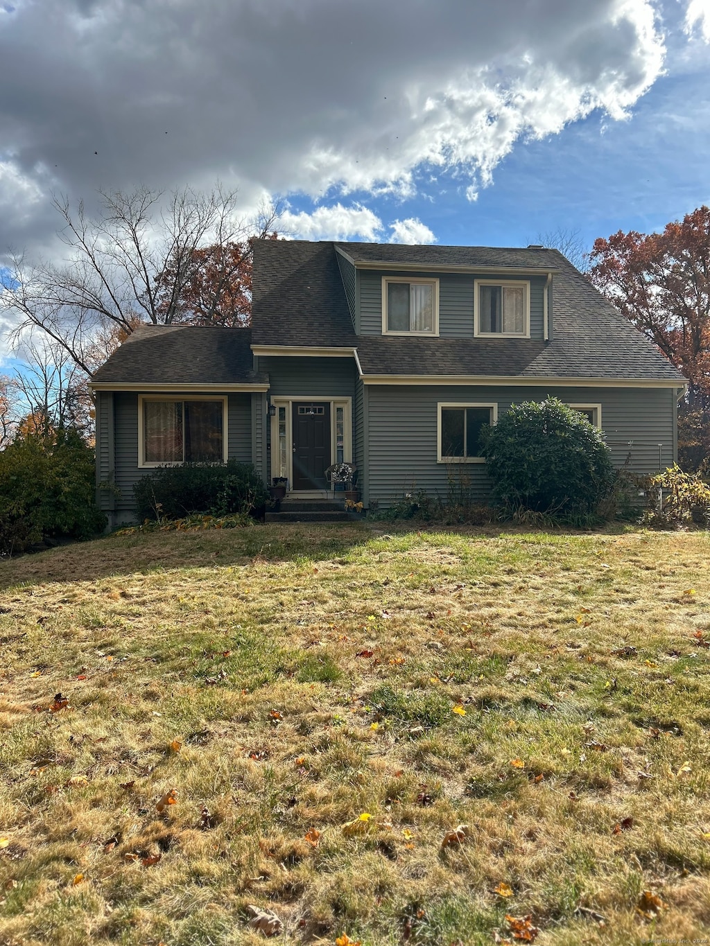 view of property with a front lawn