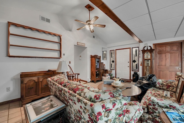 tiled living room featuring a drop ceiling, beamed ceiling, high vaulted ceiling, and ceiling fan