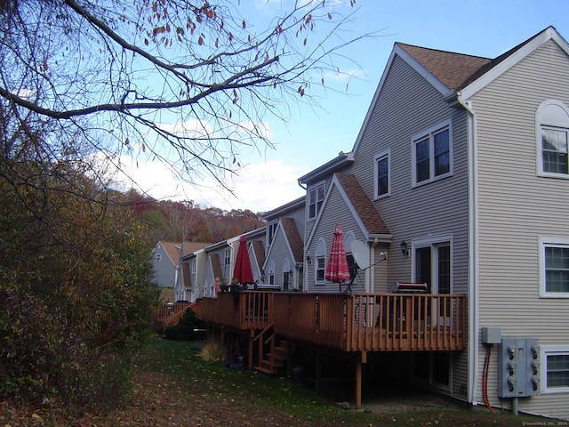 rear view of house with a wooden deck