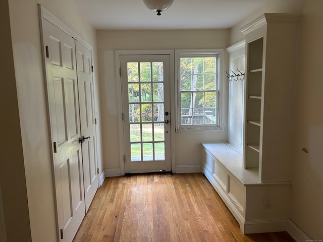 doorway with light wood-type flooring