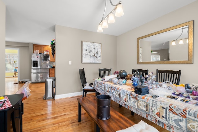 dining room with light wood-type flooring