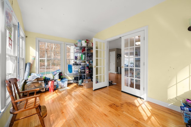 interior space with french doors and light wood-type flooring