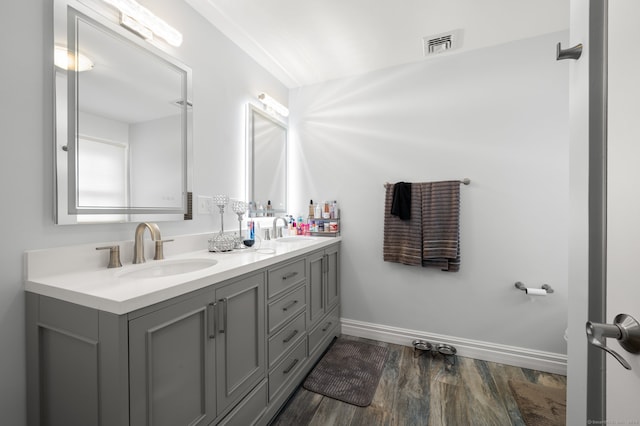 bathroom featuring vanity and hardwood / wood-style floors