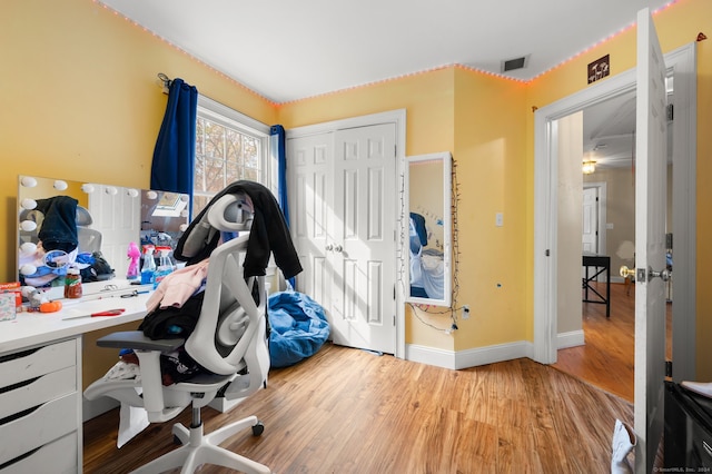 home office with hardwood / wood-style floors