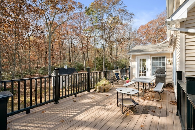 wooden terrace with area for grilling