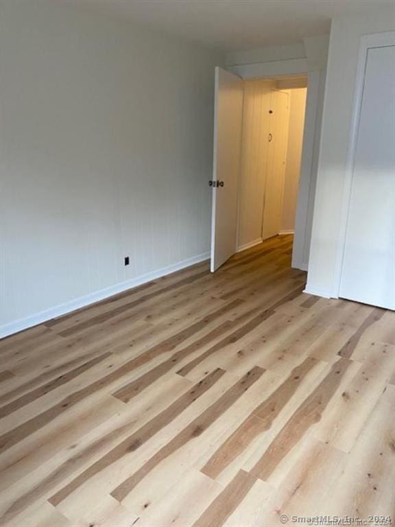 22-26 Hunters Ave, Norwich, CT 06380 - unfurnished bedroom with wood finished floors and baseboards