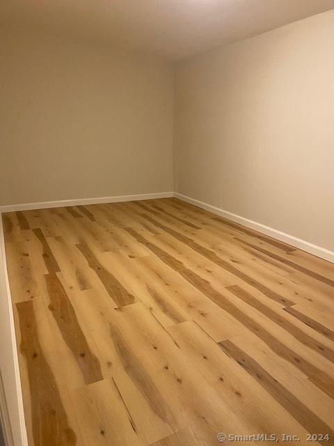 22-26 Hunters Ave, Norwich, CT 06380 - spare room with light wood-style floors and baseboards