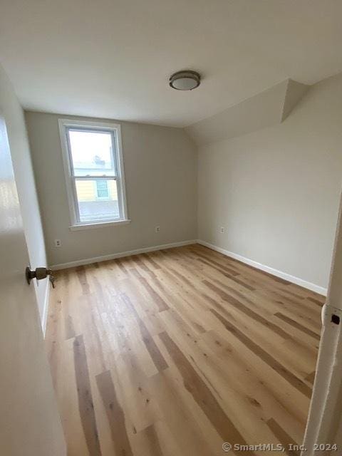 22-26 Hunters Ave, Norwich, CT 06380 - unfurnished room featuring wood finished floors and vaulted ceiling