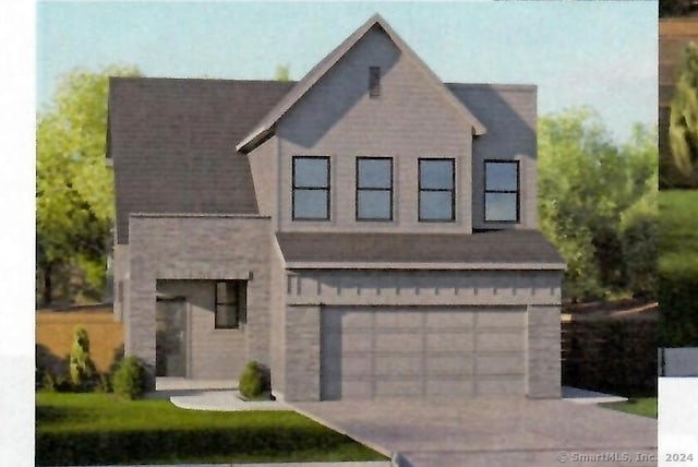 76 Highland Rd, Mansfield, CT 06250 - view of front facade featuring a garage and concrete driveway