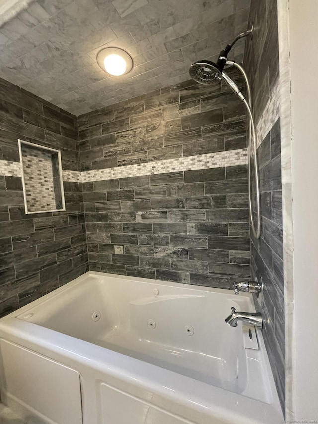 full bath with a combined bath / shower with jetted tub