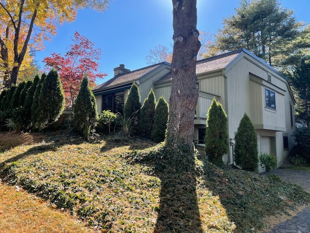 view of side of property featuring a garage