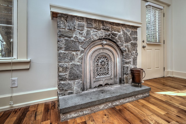 interior details with hardwood / wood-style flooring and a fireplace