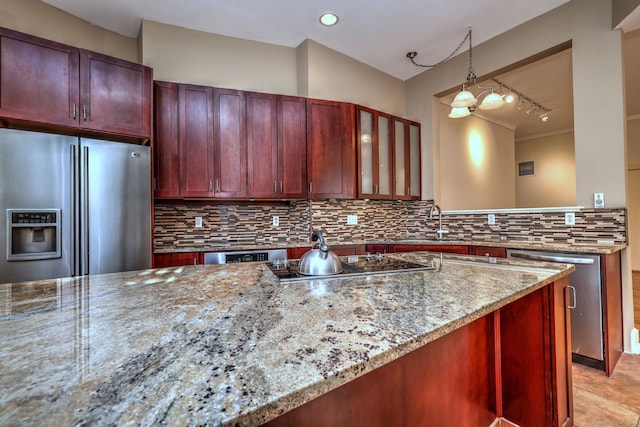 kitchen with tasteful backsplash, hanging light fixtures, stainless steel appliances, light stone counters, and ornamental molding