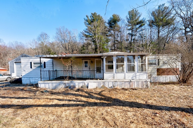 view of front of home with a sunroom