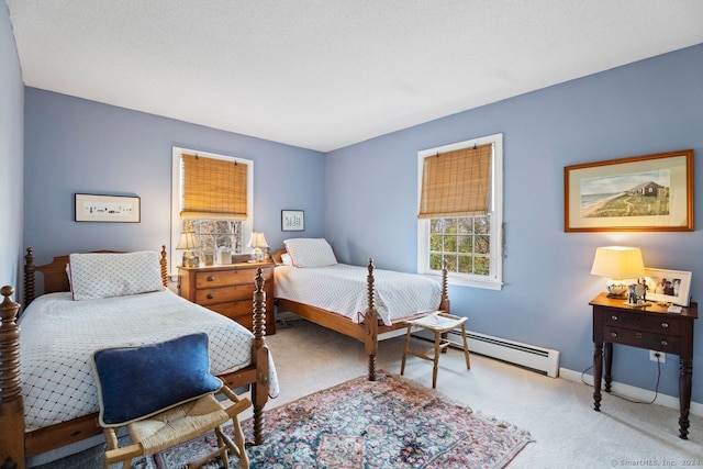 carpeted bedroom with a baseboard heating unit