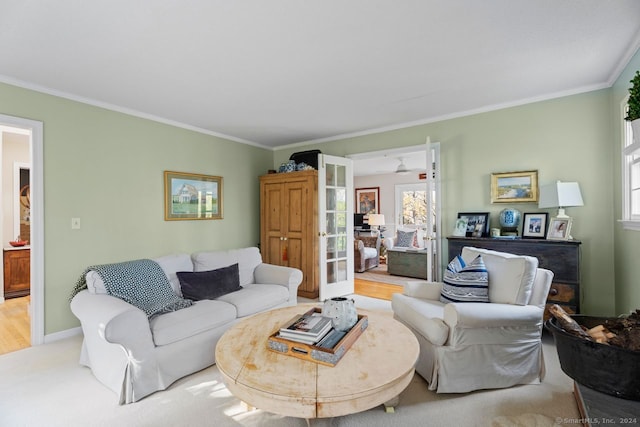 living room featuring hardwood / wood-style floors, french doors, and ornamental molding