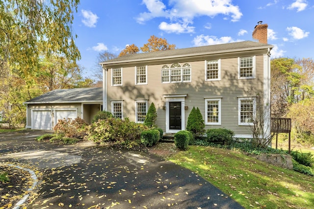 colonial inspired home with a garage