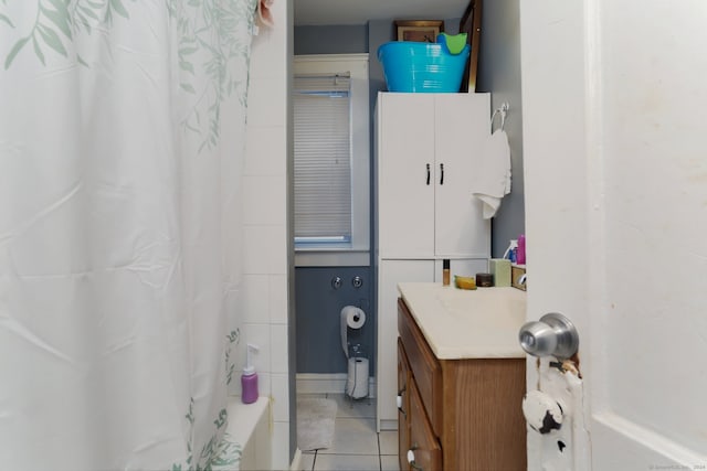 bathroom featuring vanity, tile patterned floors, and shower / tub combo