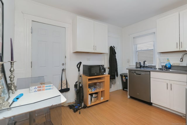 kitchen with sink, dishwasher, light wood-type flooring, white cabinets, and ornamental molding