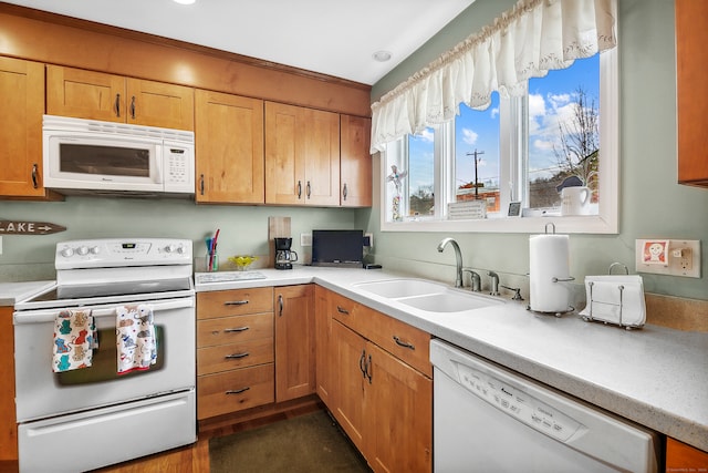 kitchen with sink and white appliances