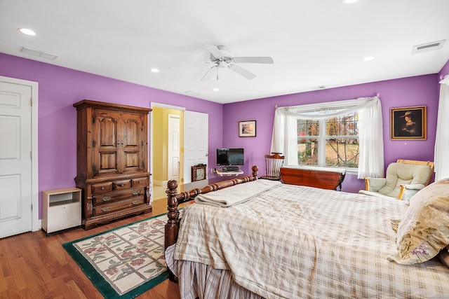 bedroom with dark wood-type flooring and ceiling fan