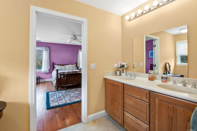 bathroom with vanity, hardwood / wood-style flooring, and ceiling fan