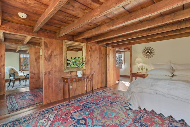 bedroom with beamed ceiling, light hardwood / wood-style floors, multiple windows, and wooden ceiling