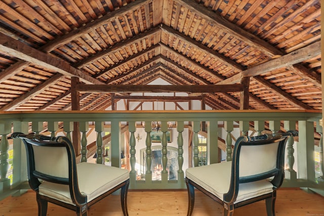 sitting room featuring wood ceiling, plenty of natural light, lofted ceiling with beams, and light wood-type flooring