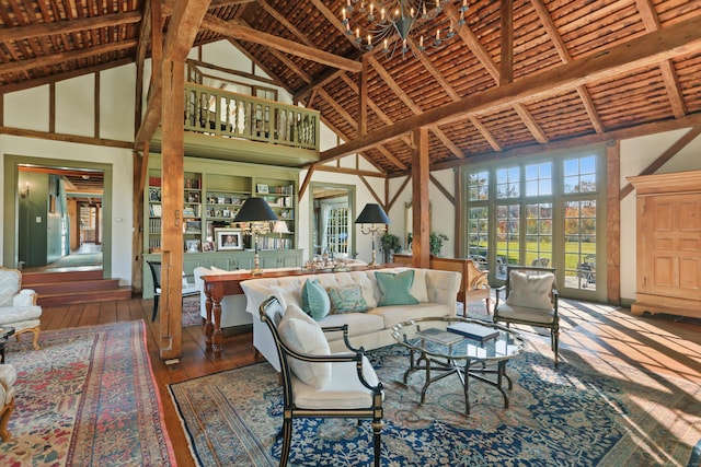 living room featuring beamed ceiling, high vaulted ceiling, and wood-type flooring