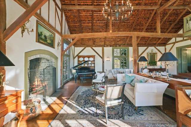 living room featuring beam ceiling, wood-type flooring, high vaulted ceiling, and an inviting chandelier