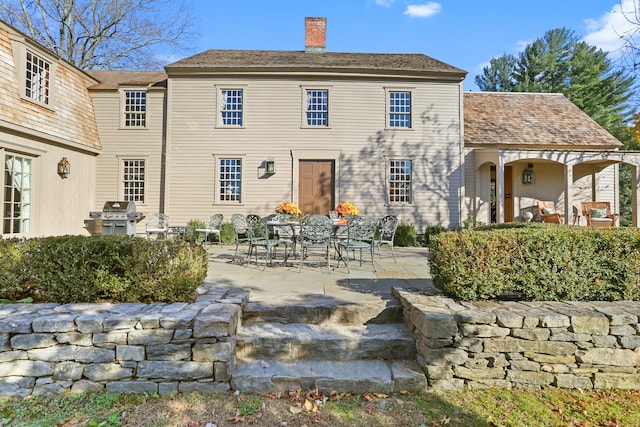 rear view of property featuring a patio