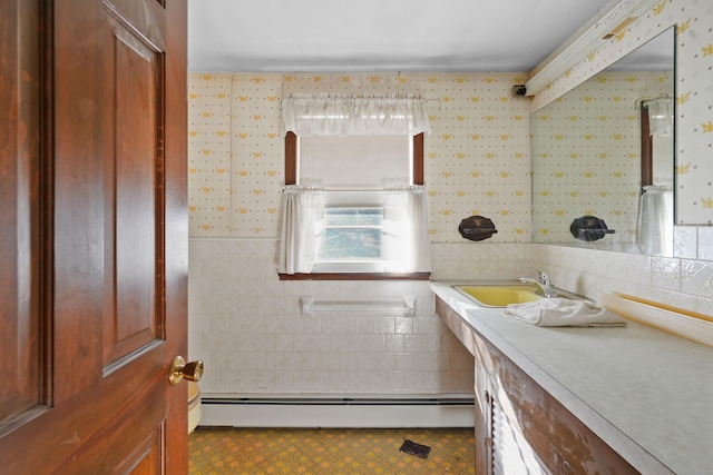82 Pendleton Hill Rd, Voluntown, CT 06384 - bathroom featuring a baseboard heating unit, vanity, wallpapered walls, tile walls, and tile patterned flooring