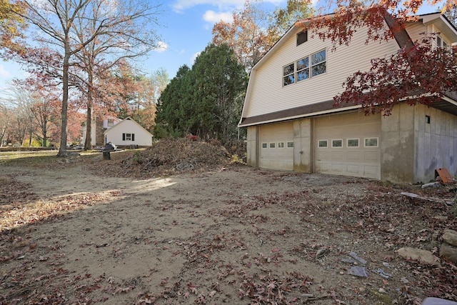 82 Pendleton Hill Rd, Voluntown, CT 06384 - view of property exterior featuring an attached garage