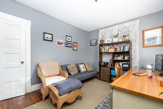 office area with hardwood / wood-style floors and baseboards