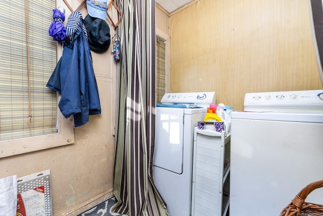 laundry area with independent washer and dryer