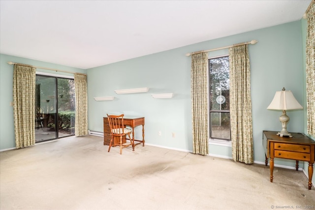 living area with light carpet and a healthy amount of sunlight