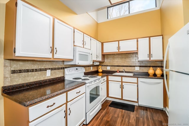 kitchen featuring dark wood-type flooring, white cabinetry, white appliances, and sink