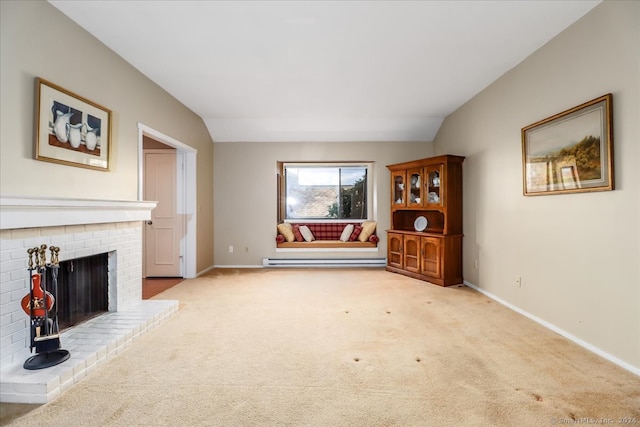 unfurnished living room with a brick fireplace, baseboard heating, lofted ceiling, and light carpet