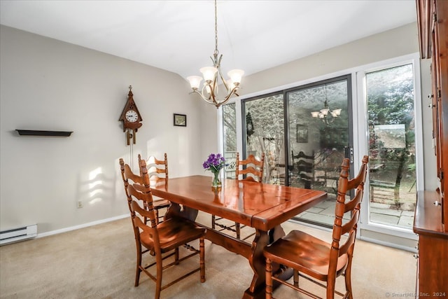 carpeted dining room featuring a baseboard heating unit, a wealth of natural light, and a chandelier