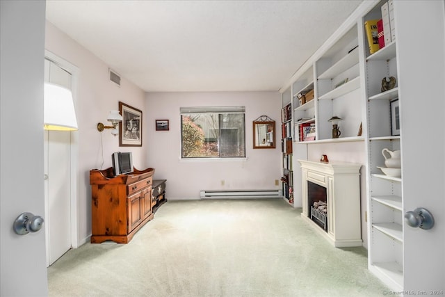 living area with light colored carpet and a baseboard heating unit