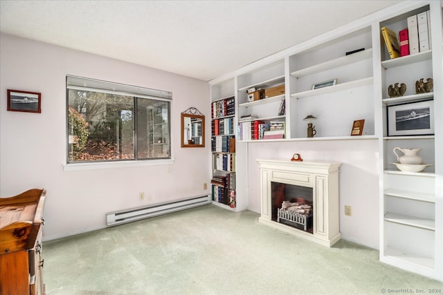 living area featuring light carpet and a baseboard heating unit