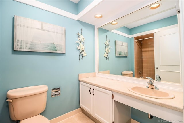 bathroom featuring toilet, vanity, and tile patterned floors