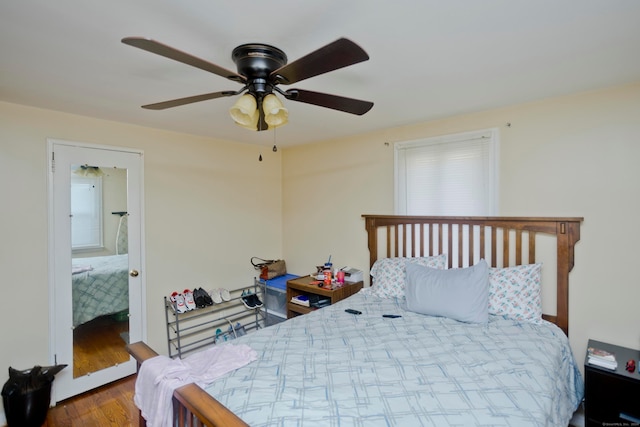 bedroom featuring wood-type flooring and ceiling fan