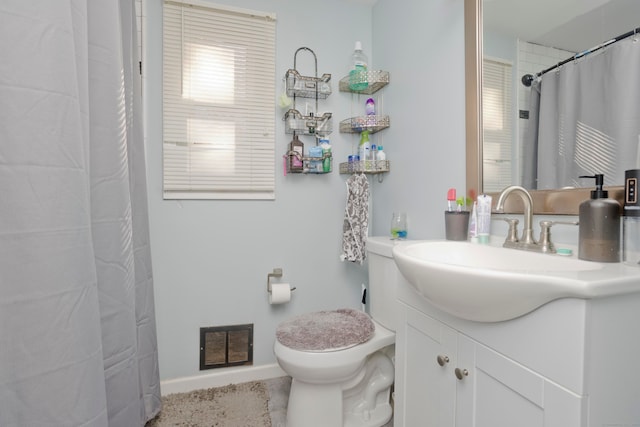 bathroom with vanity, toilet, and a shower with curtain