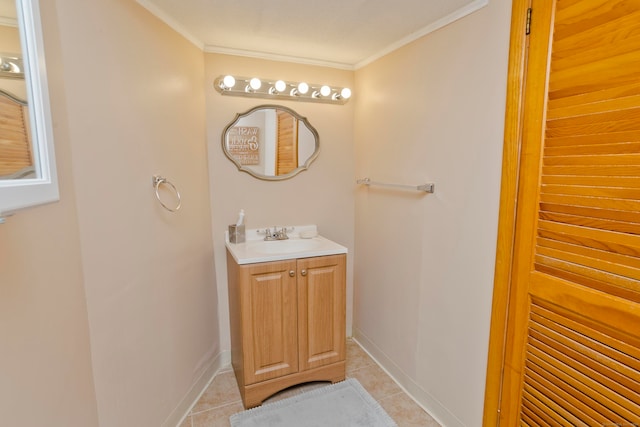 bathroom featuring vanity, ornamental molding, and tile patterned flooring