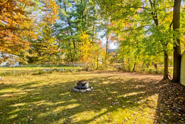 view of yard with an outdoor fire pit