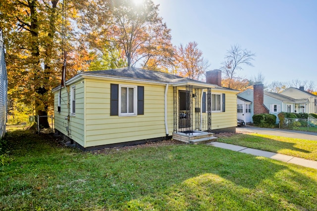 bungalow with a front lawn