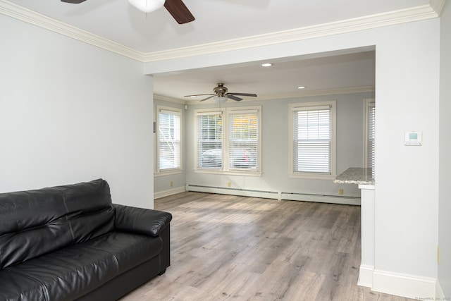 living room with light hardwood / wood-style floors, ornamental molding, a baseboard heating unit, and ceiling fan