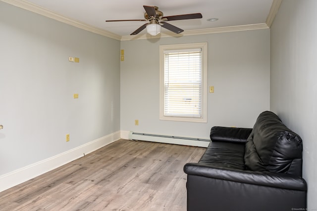 living area with crown molding, a baseboard heating unit, light hardwood / wood-style floors, and ceiling fan