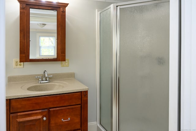 bathroom featuring vanity and walk in shower